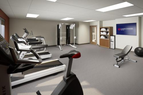 a gym with several cardio machines in a room at Candlewood Suites - Detroit - Auburn Hills by IHG in Auburn Hills
