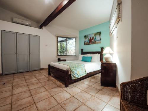 a large bedroom with a bed and a window at Bahia del Sol Beach front Boutique Hotel in Potrero