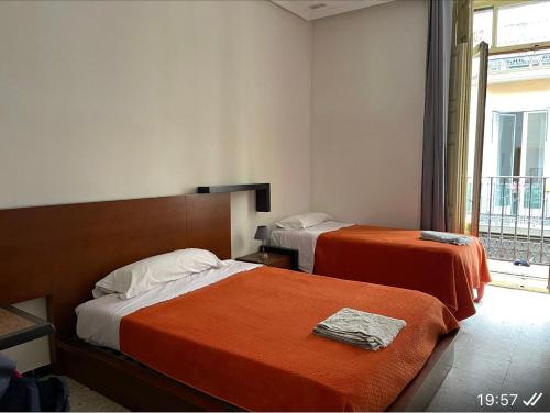 Een bed of bedden in een kamer bij Hostal “ INFANTAS”