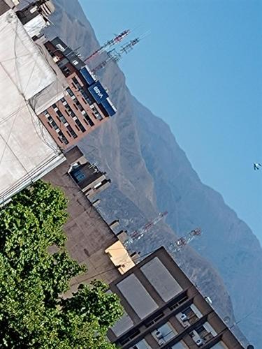 a view of a mountain with buildings on it at Mendoza Apartment in Mendoza