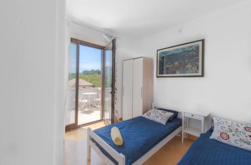 Postel nebo postele na pokoji v ubytování Apartments Villa Renata
