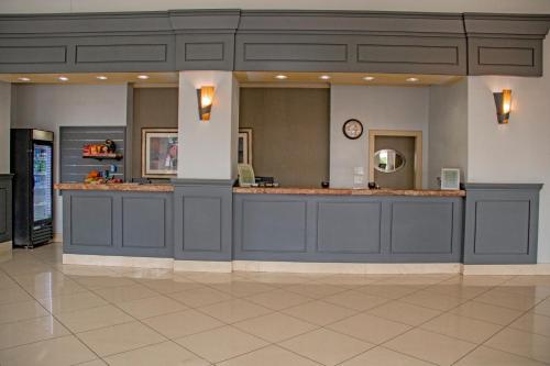 a lobby with a reception counter in a hospital at Midtown Garden Inn Phoenix in Phoenix