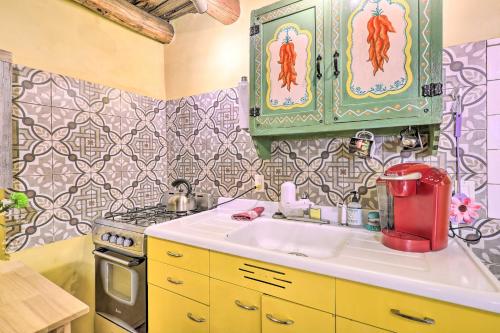 a kitchen with a sink and a stove at Artsy Santa Cruz Apartment with Shared Hot Tub in Santa Cruz