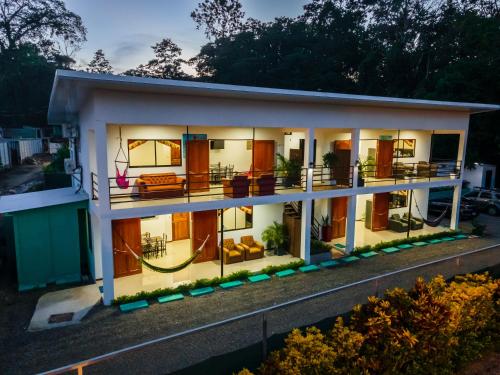 a house with a lot of windows at Villas Mapache del Caribe in Puerto Viejo