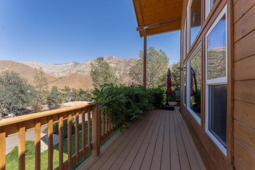a porch of a home with a view of the mountains at Epic View; A Luxury House on a Hill in Kernville