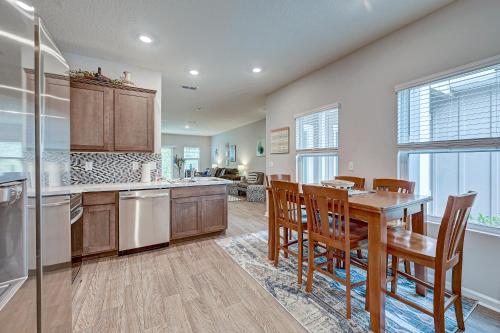 a kitchen with a table and chairs and a dining room at Relaxing Modern 2BR Home - King Bd - Near DT JAX in Jacksonville