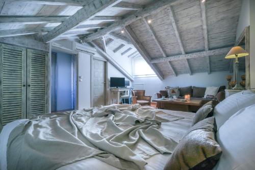 a large bed in the middle of a living room at Amymone and Adiandi in Nafplio