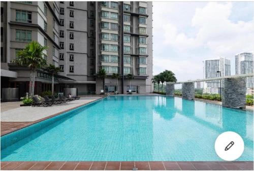 a large swimming pool in front of a building at Shaftsbury residence cyberjaya studio suites with free parking in Cyberjaya