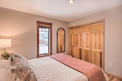 a bedroom with a bed and a large wooden cabinet at Stunning Gallatin Gateway Mountain Retreat! in Gallatin Gateway