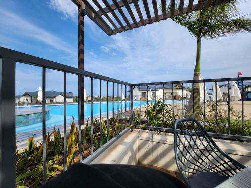 a view of the pool from the balcony of a resort at Ballito Hills Lifestyle Estate Unit 423 in Ballito