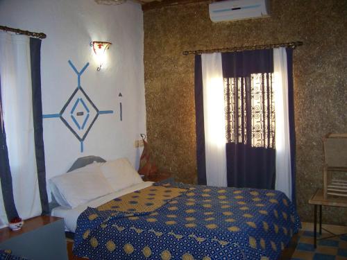 Les Portes Du Desert tesisinde bir odada yatak veya yataklar