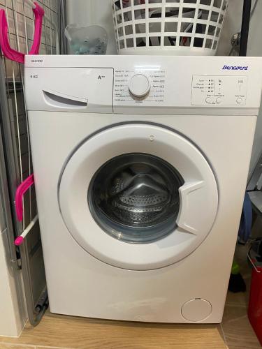 a white washing machine with its door open at El Mirador de Llançà in Llança