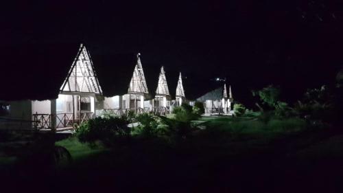 a lit up house at night with lights at SANJEELA-PLAGE COCO in Diego Suarez