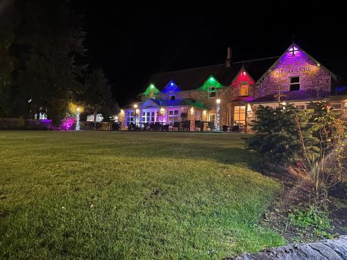 a house with christmas lights on it at night at Westlands of Pitlochry in Pitlochry