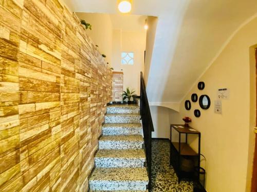 a staircase in a building with a wooden wall at Las Peñetas in Bolbaite