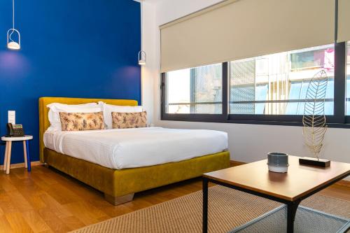 Ein Bett oder Betten in einem Zimmer der Unterkunft Iasonos Suites Athens