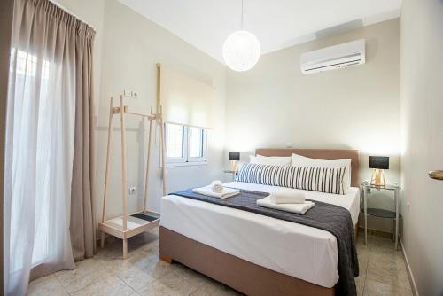 Ένα ή περισσότερα κρεβάτια σε δωμάτιο στο Elyzabeth Garden Apartment