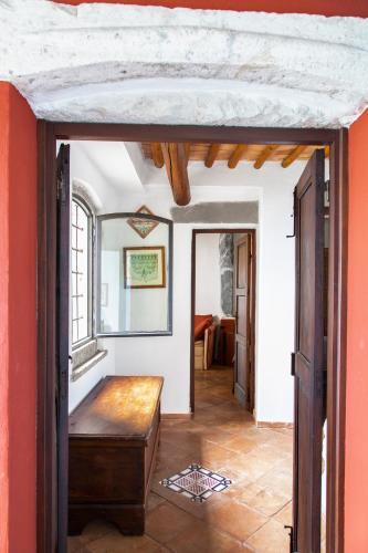 a hallway with an open door to a room at Aeneas' Landing Resort in Gaeta
