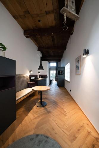 a living room with a table and a couch at TORhaus Appartments Sendenhorst in Sendenhorst