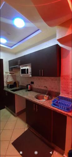 Η κουζίνα ή μικρή κουζίνα στο Apprt hôtel cabo dream 99