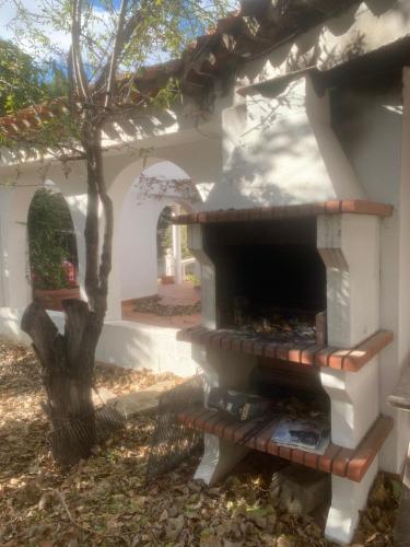 a brick oven in the side of a house at Casa con jardin in Albacete