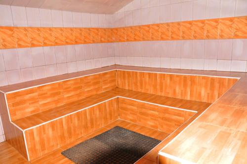 a empty room with a bench in a room at Dream jet suites in Entebbe