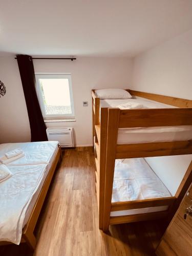 Letto o letti in una camera di PJagodic Hotel Cerklje - 5min to Airport