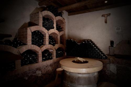 a wine cellar with a bunch of wine bottles at Agriturismo Eredi di Cobelli Aldo in Lavis