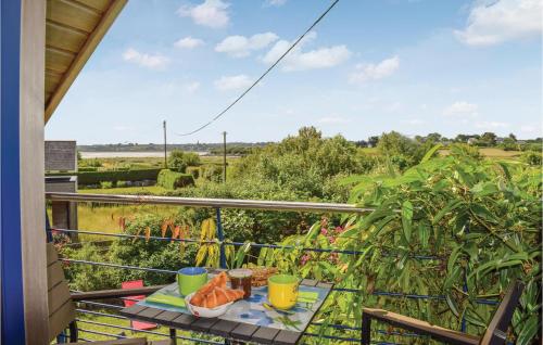 a balcony with a table with food on it at Nice Home In Plounéour-Trez With Sauna in Plounéour-Trez
