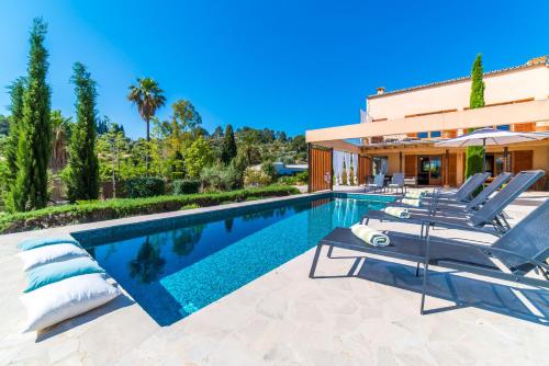a villa with a swimming pool and a house at Ideal Property Mallorca - Sa Vinyeta in Selva