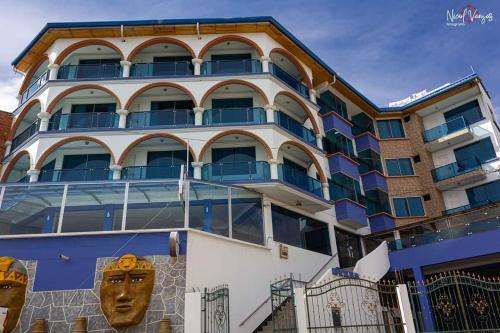 a building with a face painted on the side of it at Hotel Lago Azul in Copacabana