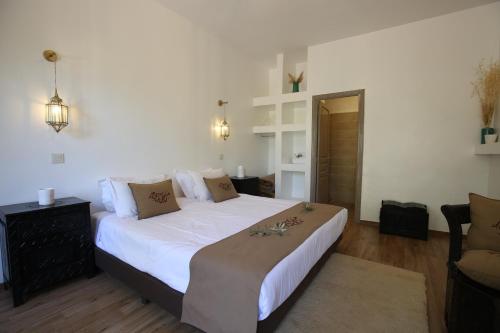 Ein Bett oder Betten in einem Zimmer der Unterkunft Ksar Shama - Atlas Mountain Escape