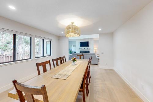 a dining room and kitchen with a table and chairs at Pebble Beach Abundant Oasis in Pebble Beach