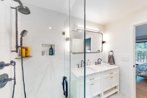 a bathroom with a shower and a sink at Pebble Beach Abundant Oasis in Pebble Beach