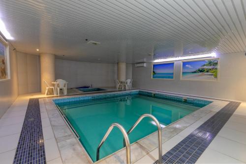 a swimming pool in a house with a ceiling at Royal Boutique Hotel in Khamis Mushayt