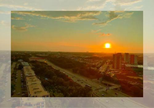 a view of a city with the sunset in the background at Cozy 2R2B Relaxing Skyline Views #GA2 in Shah Alam