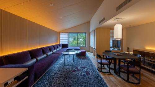 a living room with a couch and a table at Fufu Kyoto in Kyoto