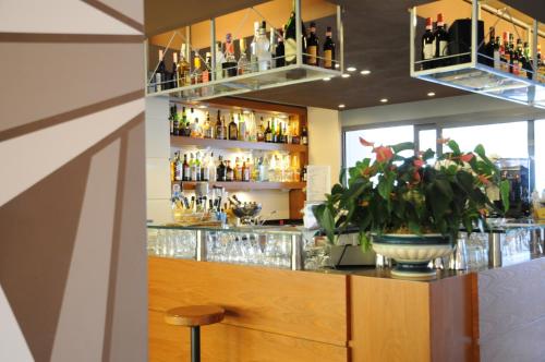 a bar with a lot of bottles of alcohol at Grand Hotel Continental in Tirrenia