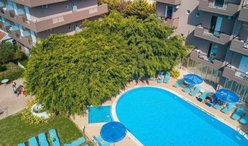 an overhead view of a swimming pool in front of a building at Castro Hotel in Amoudara Herakliou