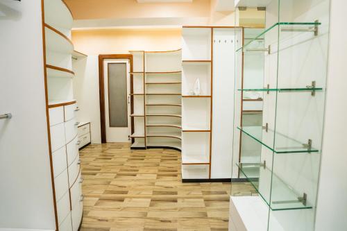 a room with glass shelves and a hallway at East Land Bed & Breakfast in Shillong