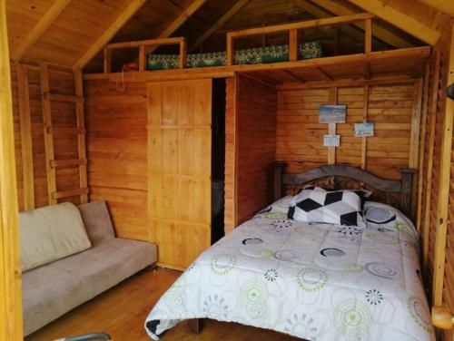 Postel nebo postele na pokoji v ubytování Cabañas Guatavita