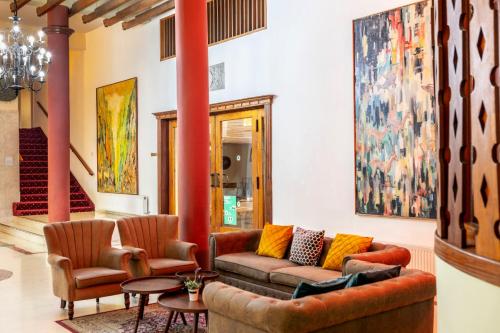 a living room with a couch and two chairs at Forest Park Hotel in Platres