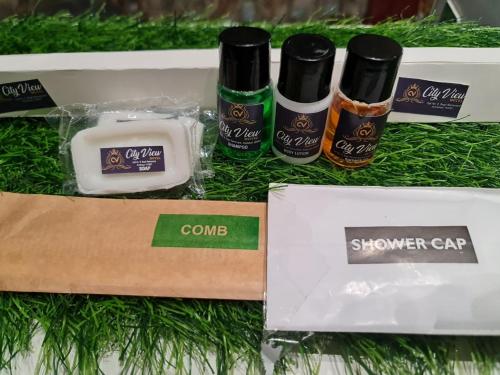 a box of shower care products sitting on the grass at City View With Garden -5 Mins Walk From GOLDEN TEMPLE in Amritsar