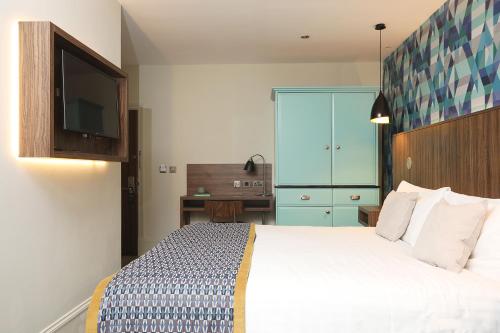 Cairn Hotel & Apartmentsにあるベッド