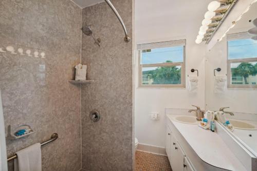 a bathroom with a shower and a sink at Friendly Native 507 in St Pete Beach