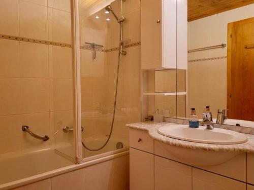 a bathroom with a sink and a shower at Highest terrace Verbier center. Top comfort & view in Verbier