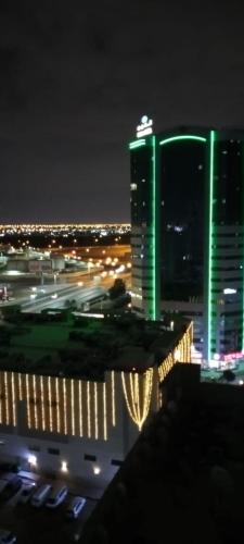 a view of a city at night with buildings at بناية يا هلا in Ajman 