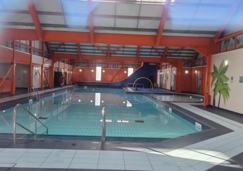 a large indoor swimming pool with a large pool at MV18 Park Holidays, St Osyth Beach no smoking self catering holiday in Saint Osyth