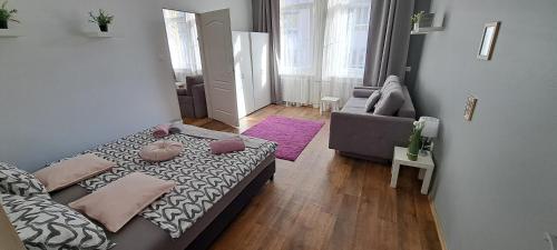 Posteľ alebo postele v izbe v ubytovaní Sweet 16 Apartment in the Party District