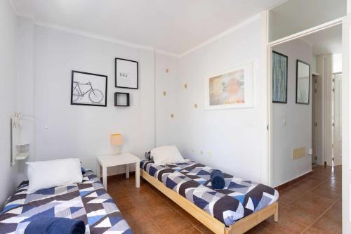 Postel nebo postele na pokoji v ubytování Callao Perfect Stay by Sunkeyrents